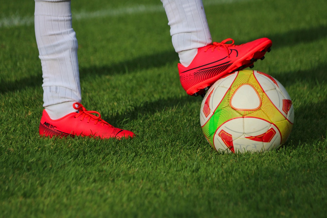 ball, football, sport, soccer, soccer ball, football shoes, soccer shoes, football field, soccer field, grass, athlete, football player, soccer player, legs, feet, nature, footwear